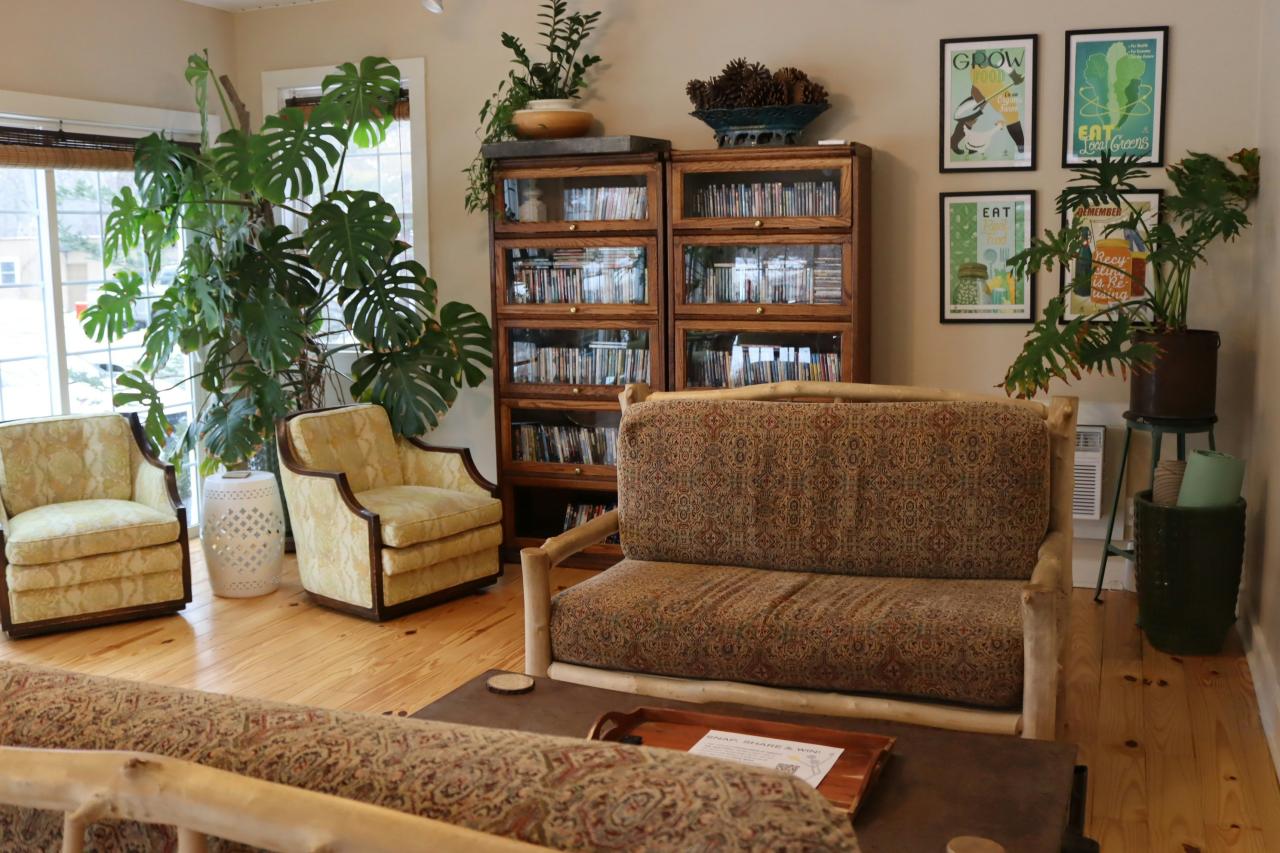 Cozy living room with plants and vintage furniture