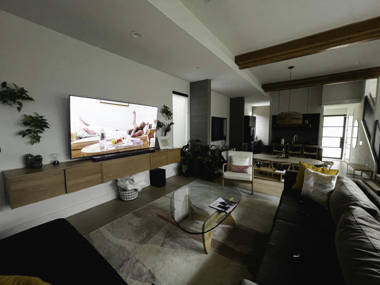 A living room filled with furniture and a flat screen TV