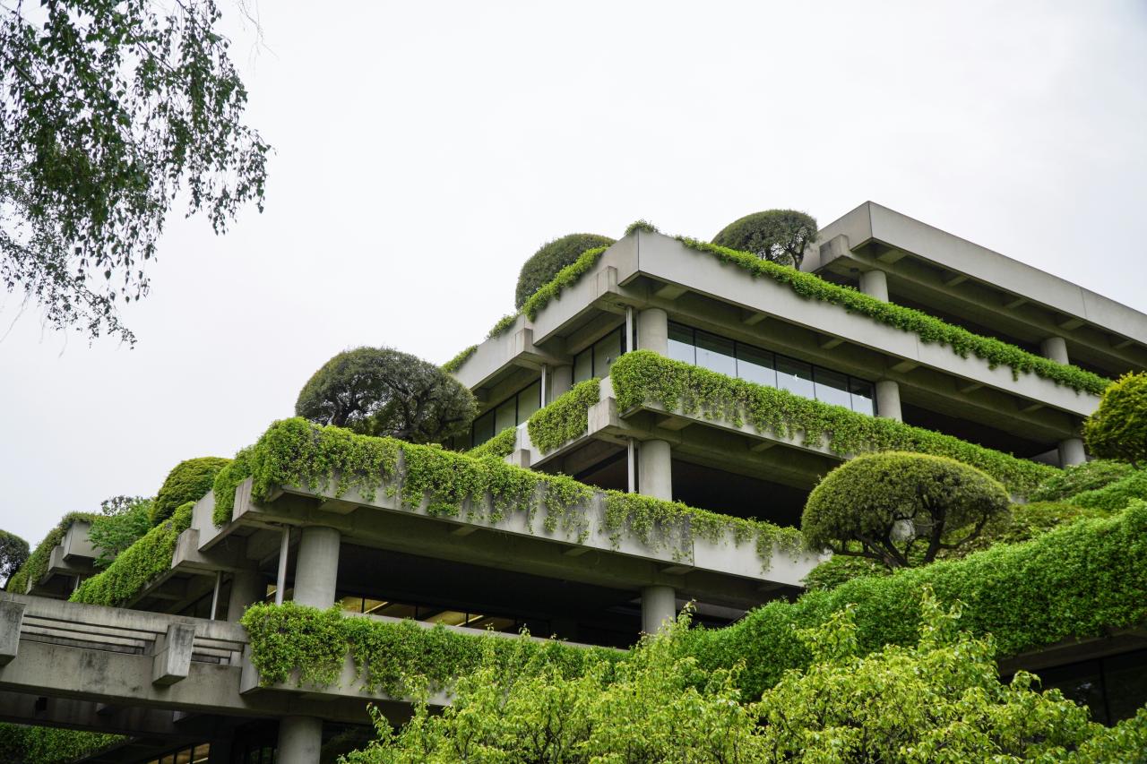 a building with a lot of plants growing on it