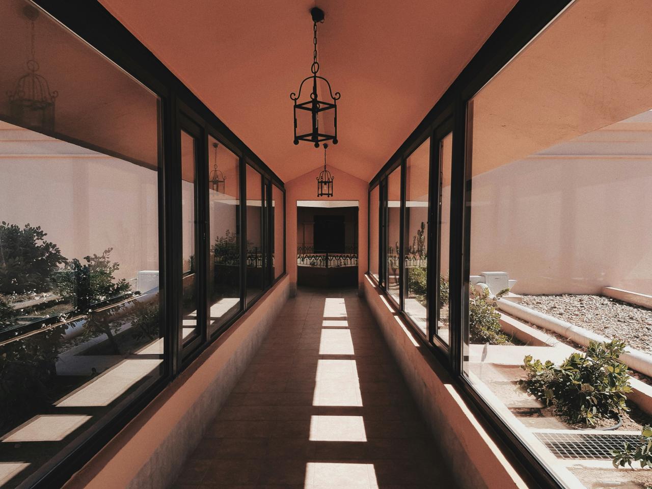 brown and white tiled hallway